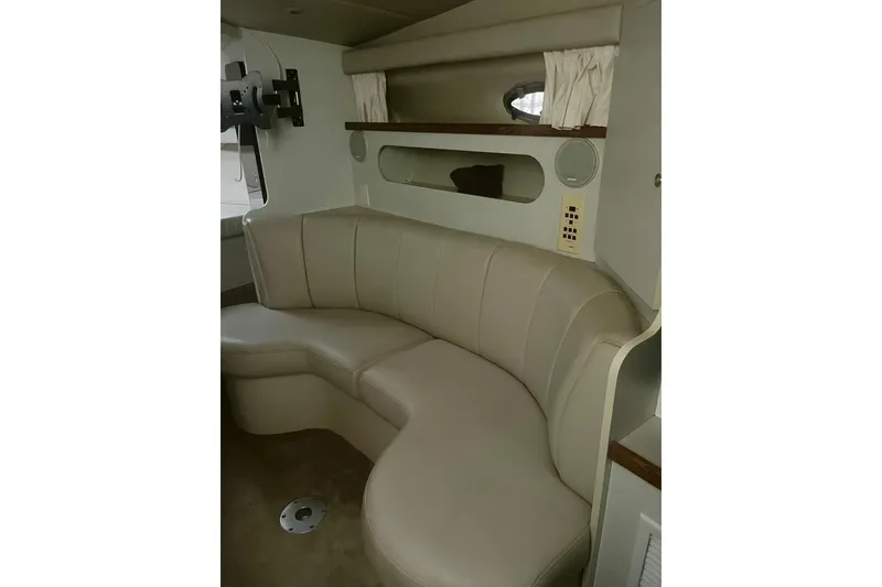 Slide: The Image of 1997 Cruisers Yachts 3075 Rogue interior with beige leather seating and modern design. - 13