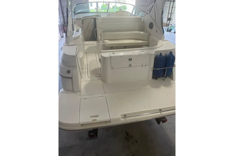 Slide: The Image of 1997 Cruisers Yachts 3075 Rogue boat interior with seating and storage compartments. - 4