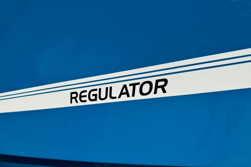 Slide: The Image of 2017 Regulator 28 boat logo on blue background. - 10