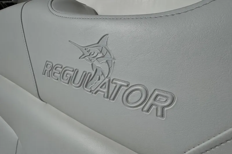 Slide: The Image of 2017 Regulator 28 boat seat with embossed logo and marlin design. - 18