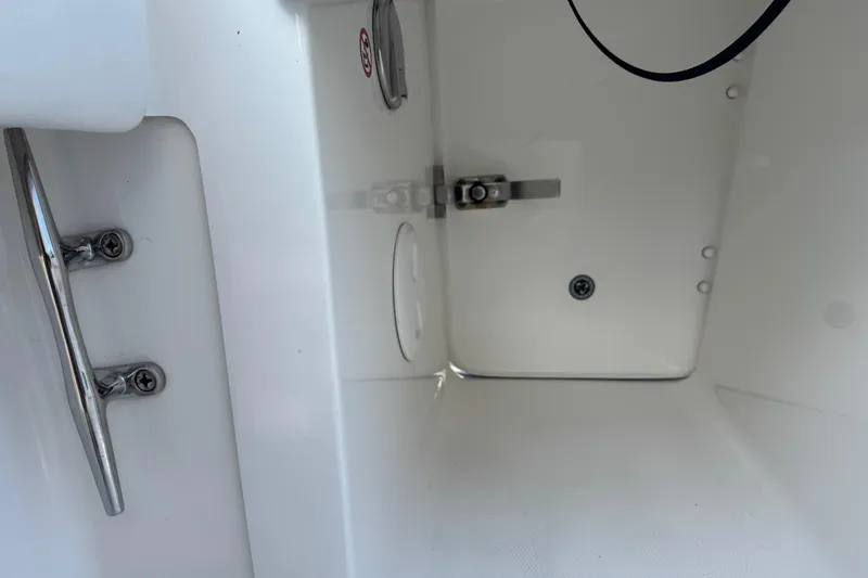 Slide: The Image of 2017 Regulator 28 boat interior compartment with stainless steel hardware. - 22