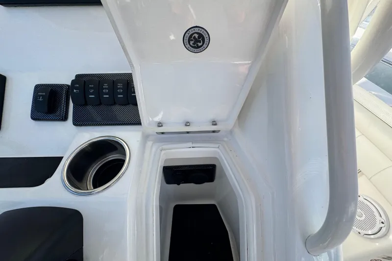 Slide: The Image of 2017 Regulator 28 boat console with control panel and cup holder. - 45