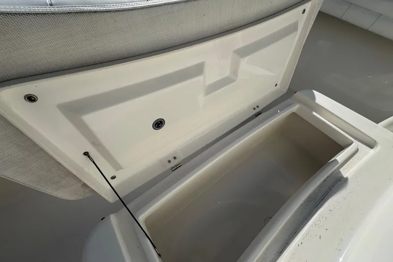 Slide: The Image of Open storage compartment on a 2017 Regulator 28 boat, showcasing interior space. - 47