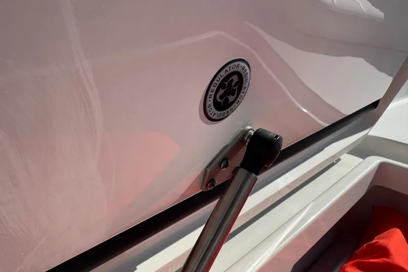 Slide: The Image of 2017 Regulator 28 boat detail with logo and hydraulic support. - 51
