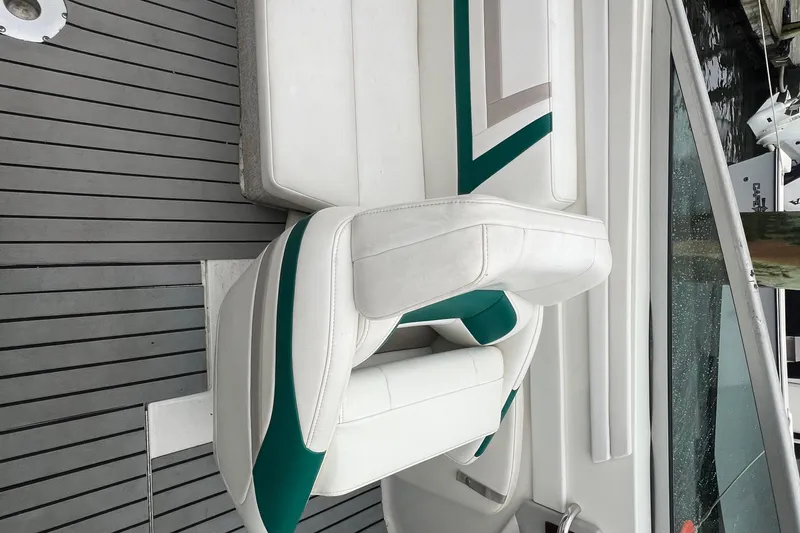 Slide: The Image of White and green seating on a 1998 Formula 252 SS boat deck. - 16