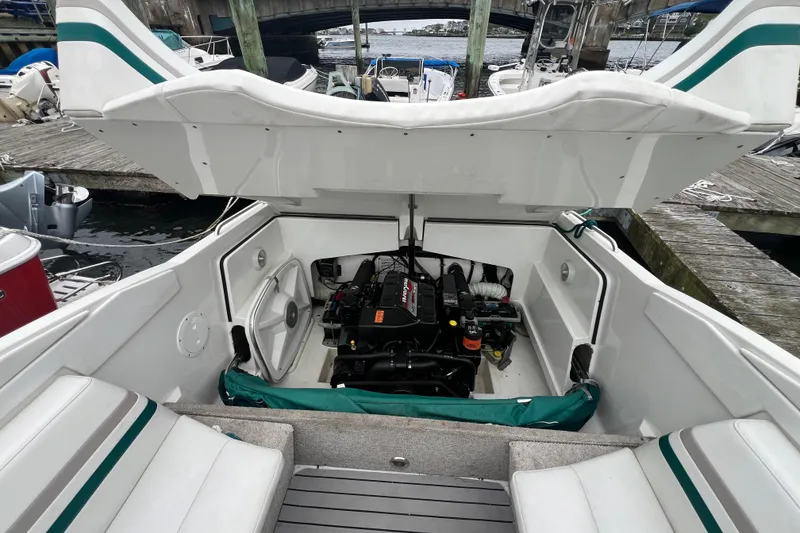 Slide: The Image of 1998 Formula 252 SS boat engine compartment open at dockside. - 28