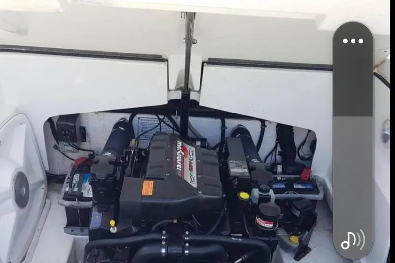 Slide: The Image of Engine compartment of a 1998 Formula 252 SS boat, featuring a MerCruiser engine. - 7