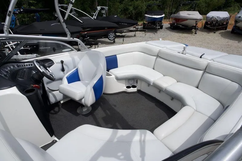 Slide: The Image of 2003 Tigé 22V Riders Edition boat interior with white and blue seating. - 10