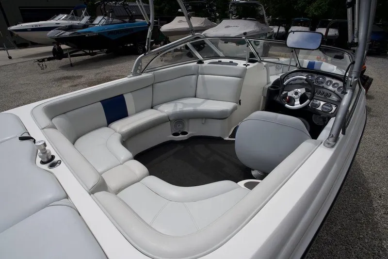 Slide: The Image of 2003 Tigé 22V Riders Edition boat interior with white seating and modern dashboard. - 12