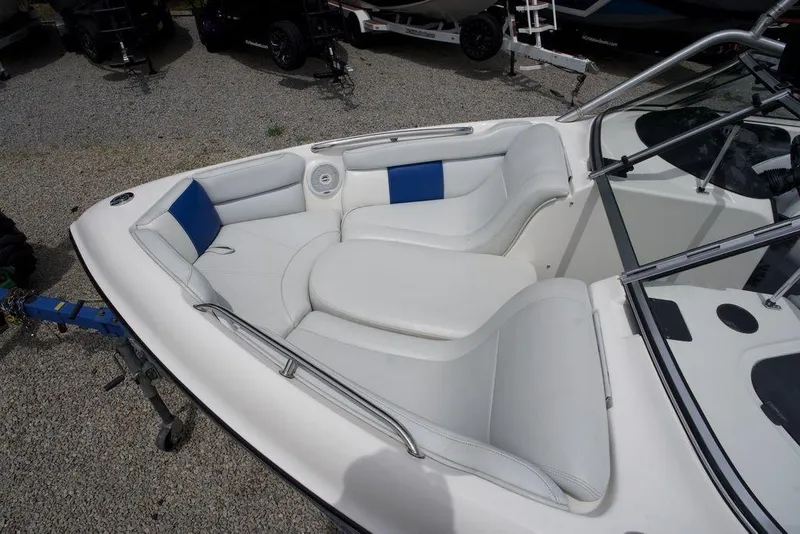 Slide: The Image of 2003 Tigé 22V Riders Edition boat interior with white and blue seating. - 7