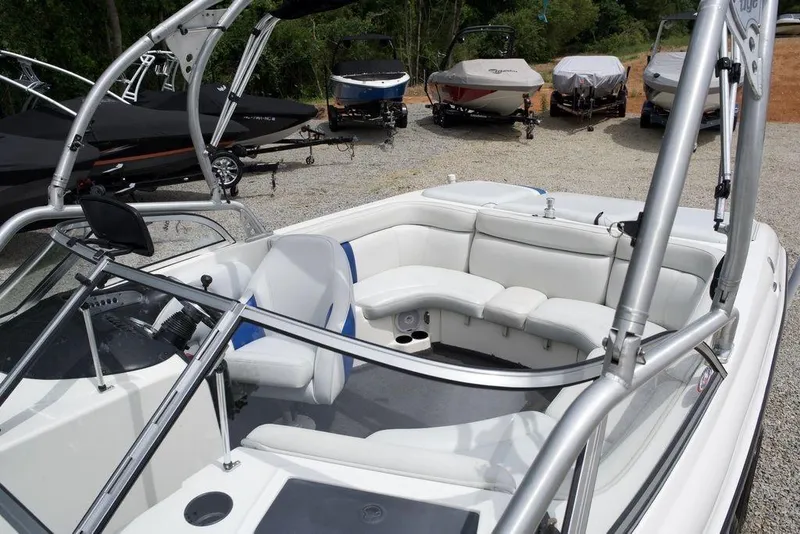 Slide: The Image of 2003 Tigé 22V Riders Edition boat with white interior and seating area. - 8
