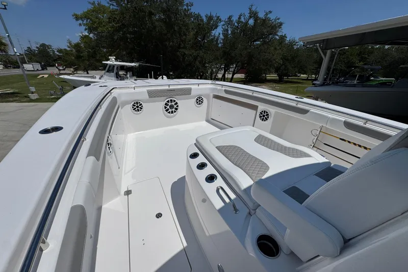 Slide: The Image of 2025 Caymas 34 CT boat interior with white seating and speaker system. - 19