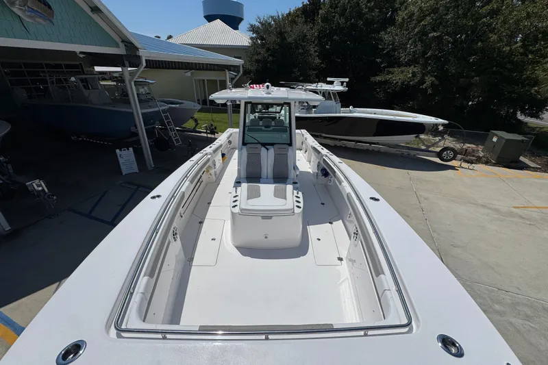 Slide: The Image of 2025 Caymas 34 CT boat docked, showcasing spacious deck and modern design. - 23