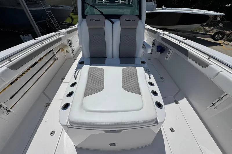 Slide: The Image of 2025 Caymas 34 CT boat interior with cushioned seating and modern design. - 25