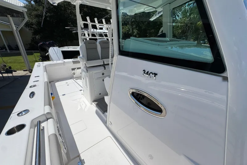 Slide: The Image of 2025 Caymas 34 CT boat interior with seating and fishing rod holders. - 28