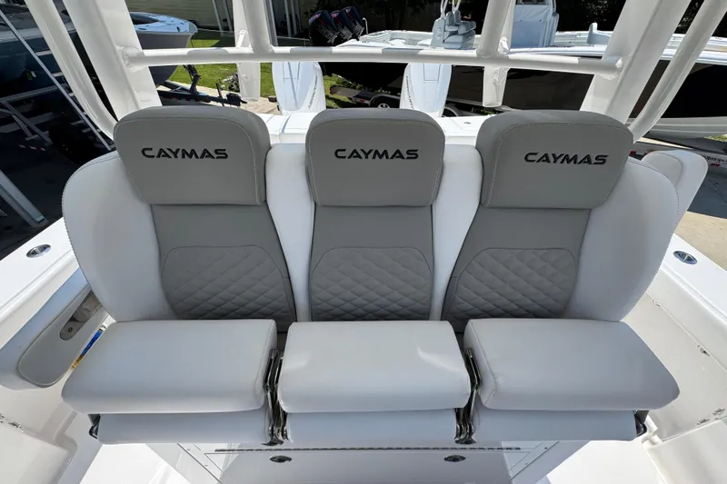 Slide: The Image of 2025 Caymas 34 CT boat seating with gray and white cushioned seats. - 30