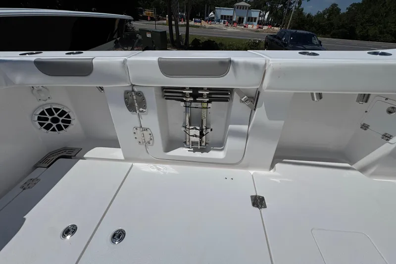 Slide: The Image of 2025 Caymas 34 CT boat interior with seating and storage compartments. - 39