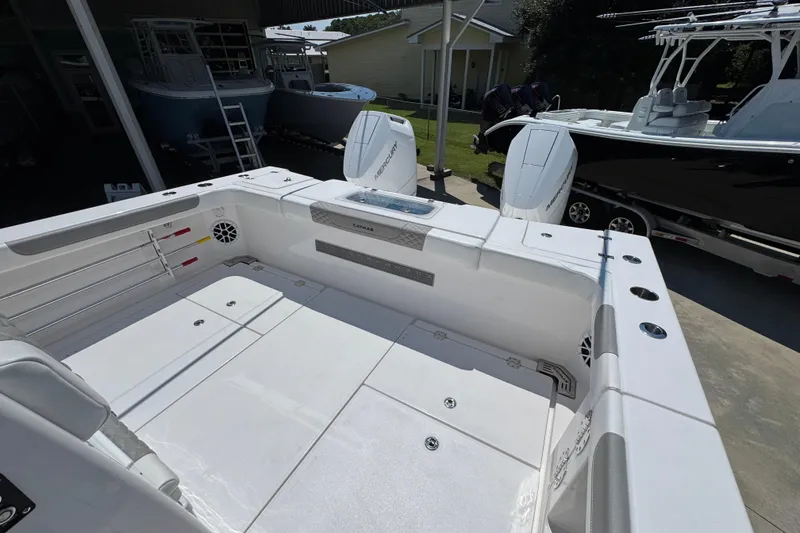 Slide: The Image of 2025 Caymas 34 CT boat interior with spacious deck and twin Mercury engines. - 43