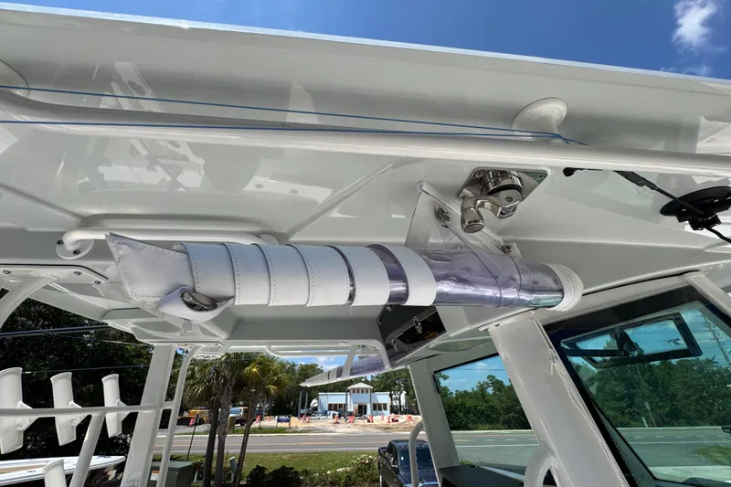 Slide: The Image of 2025 Caymas 34 CT boat interior with mounted equipment and clear blue sky. - 48