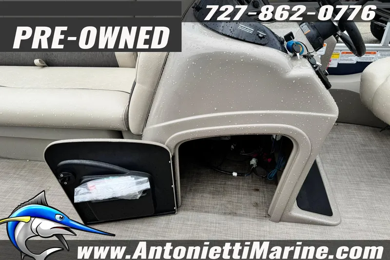 Slide: The Image of Pre-owned 2022 Sun Tracker 22 Sport Fish DLX boat interior with storage compartment. - 15