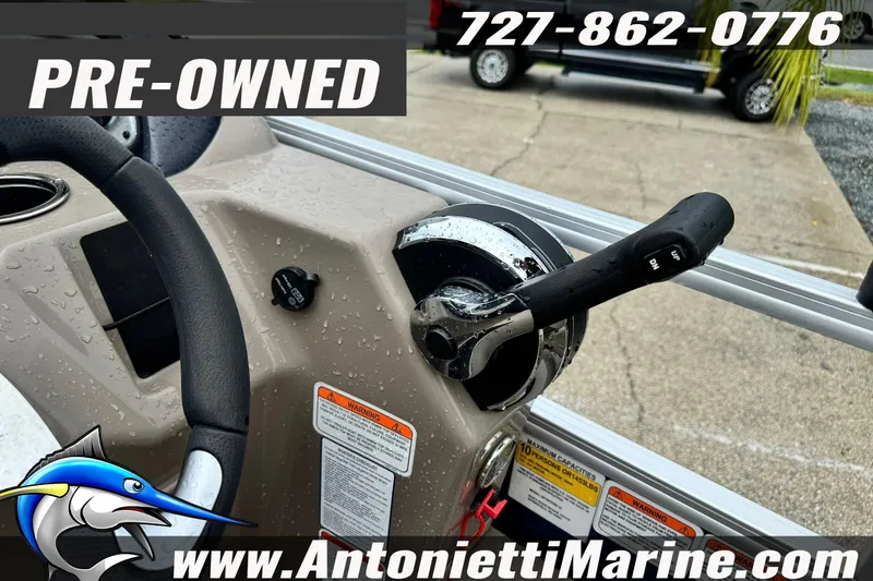 Slide: The Image of Pre-owned 2022 Sun Tracker 22 Sport Fish DLX boat control panel with contact details. - 20
