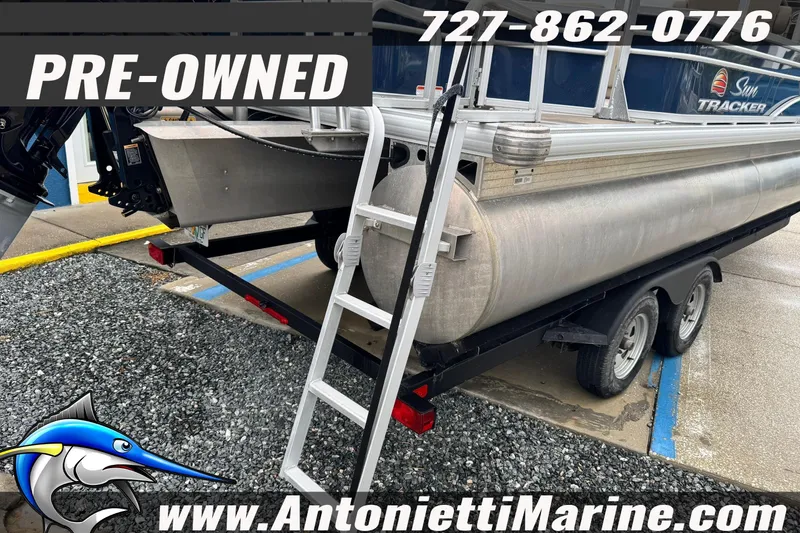 Slide: The Image of Pre-owned 2022 Sun Tracker 22 Sport Fish DLX pontoon boat on trailer, contact Antonietti Marine. - 3