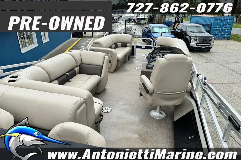 Slide: The Image of Pre-owned 2022 Sun Tracker 22 Sport Fish DLX pontoon boat with spacious seating and modern design. - 6