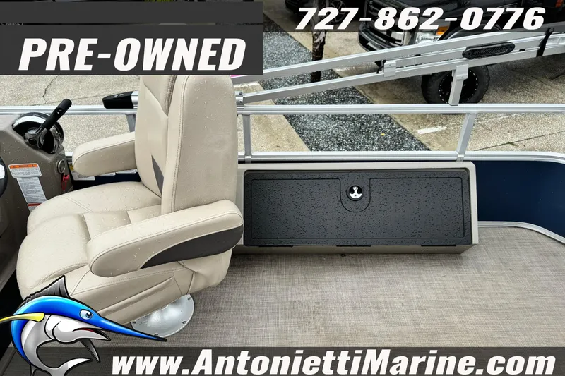 Slide: The Image of Pre-owned 2022 Sun Tracker 22 Sport Fish DLX boat interior with beige seating. - 9
