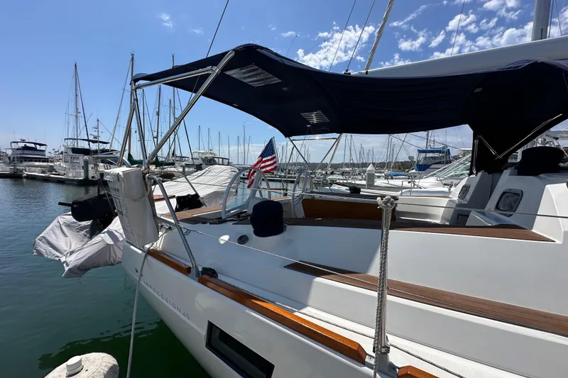 Slide: The Image of 2018 Elan 45 Impressions yacht docked at marina under clear blue sky. - 11