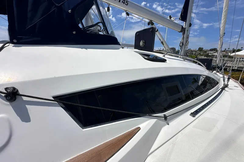 Slide: The Image of 2018 Elan 45 Impressions yacht with sleek design and modern features, docked under blue skies. - 12