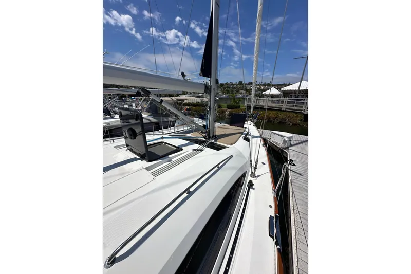 Slide: The Image of 2018 Elan 45 Impressions yacht deck with clear sky and marina view. - 13