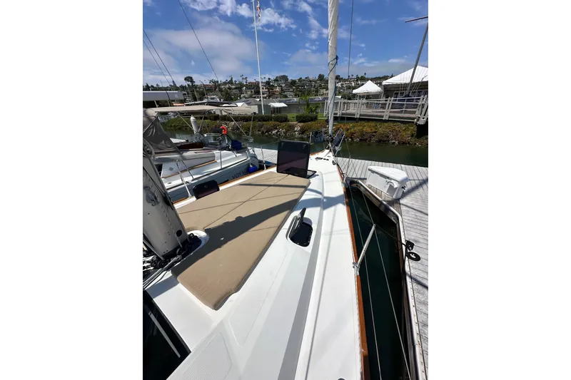 Slide: The Image of 2018 Elan 45 Impressions yacht docked at marina under blue sky. - 14