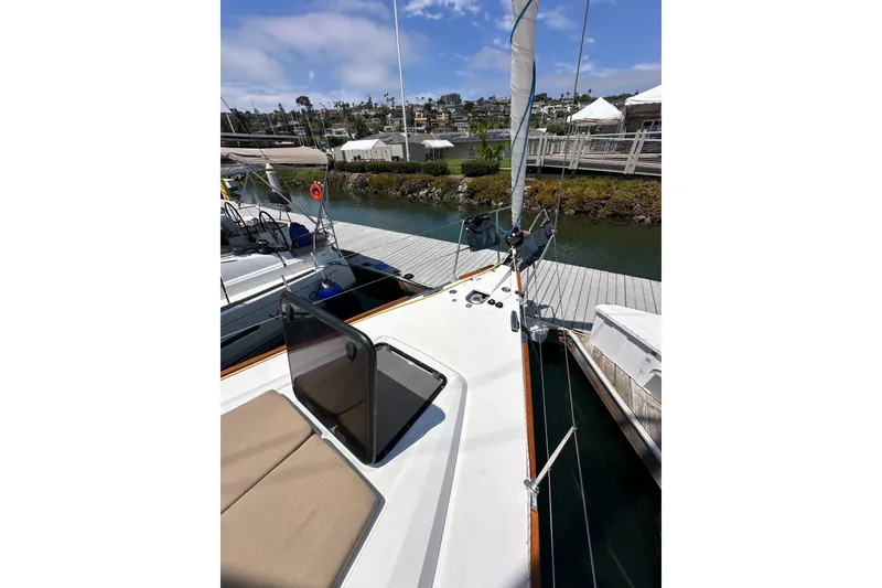 Slide: The Image of 2018 Elan 45 Impressions yacht docked at marina, showcasing deck and sail. - 15
