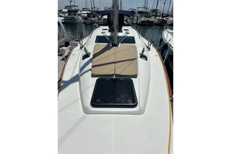 Slide: The Image of 2018 Elan 45 Impressions yacht deck with sunbathing area in marina. - 18