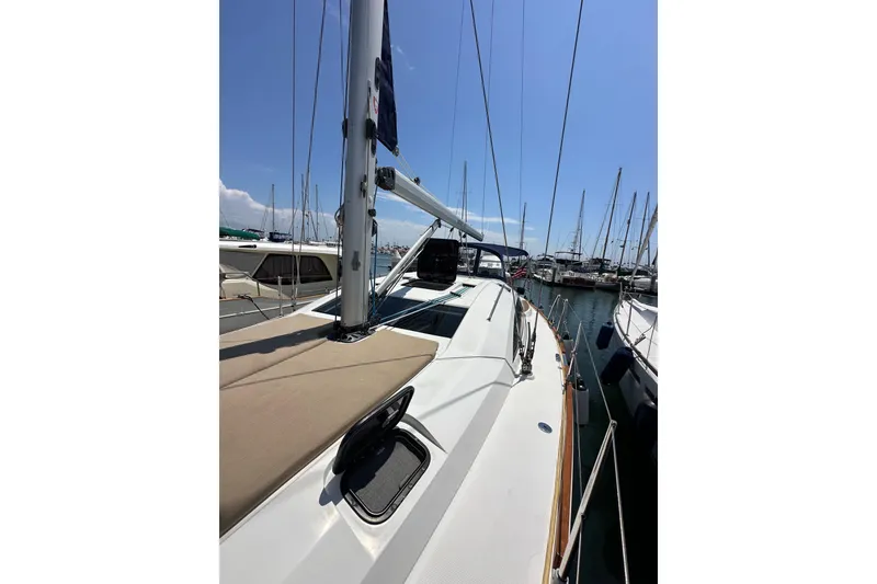 Slide: The Image of 2018 Elan 45 Impressions sailboat docked in a marina under clear blue skies. - 19