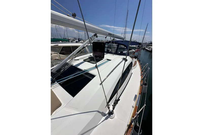 Slide: The Image of 2018 Elan 45 Impressions yacht docked at marina, showcasing sleek deck design. - 20