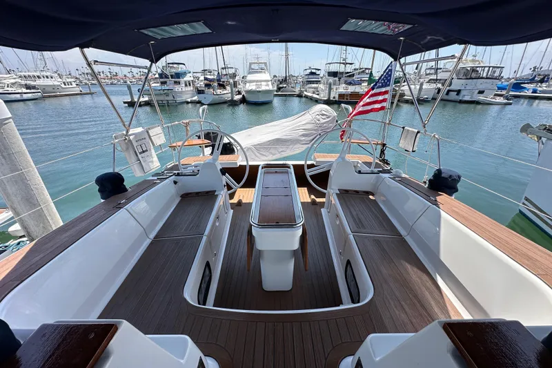 Slide: The Image of Spacious cockpit of 2018 Elan 45 Impressions yacht docked at marina. - 24