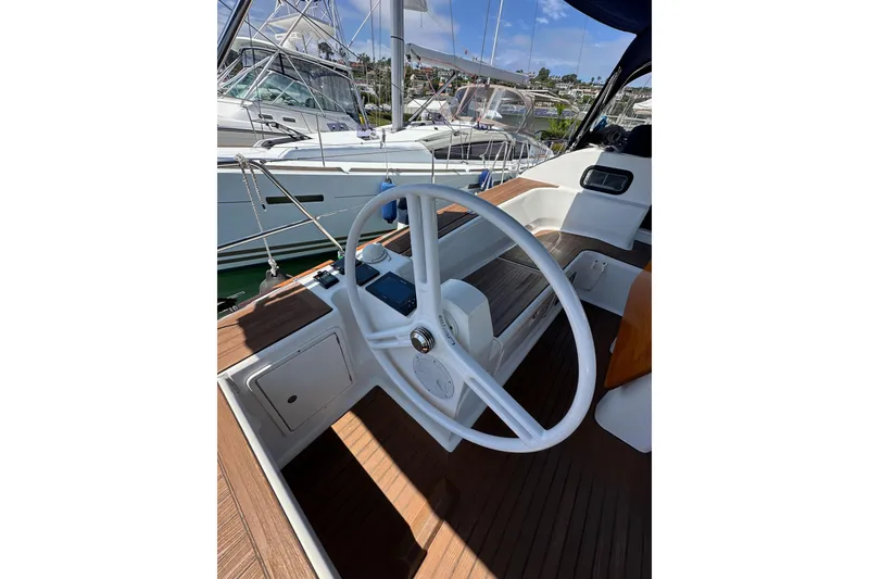 Slide: The Image of Steering wheel of 2018 Elan 45 Impressions yacht, docked at marina. - 29