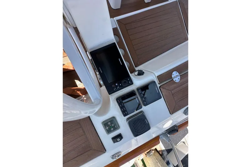 Slide: The Image of Control panel of a 2018 Elan 45 Impressions yacht with navigation equipment. - 32