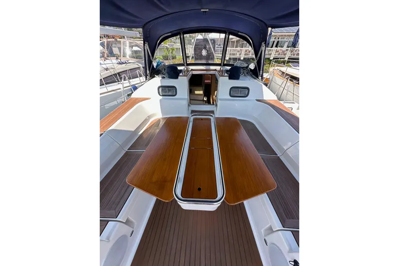Slide: The Image of 2018 Elan 45 Impressions yacht cockpit with wooden table and seating area. - 38