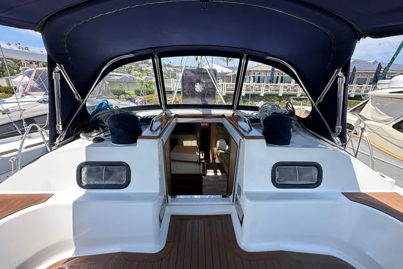 Slide: The Image of Cockpit view of 2018 Elan 45 Impressions yacht with open cabin entrance. - 39