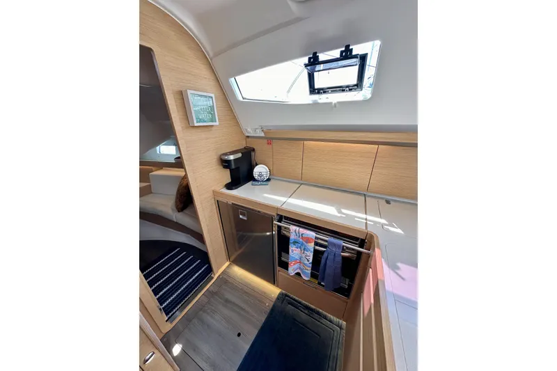 Slide: The Image of Modern interior of 2018 Elan 45 Impressions yacht, featuring sleek kitchen and cozy seating area. - 44