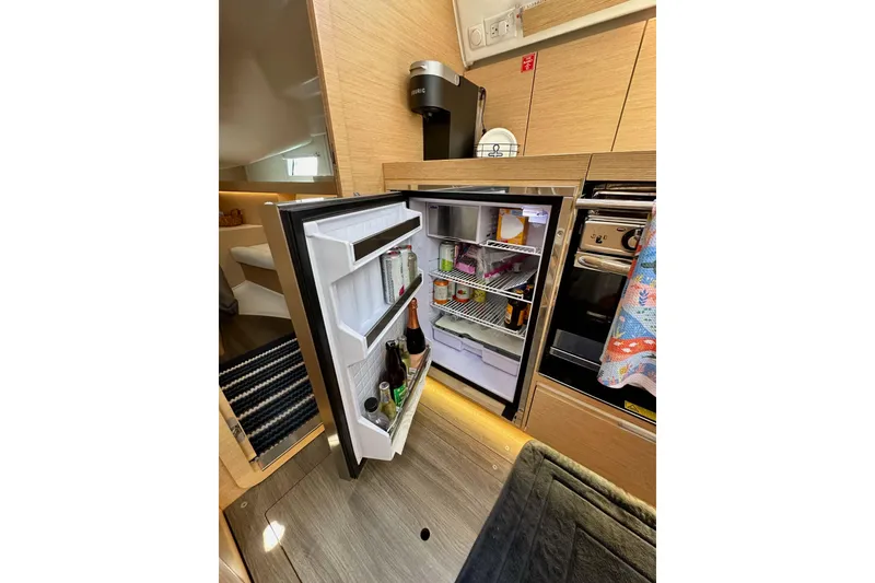 Slide: The Image of Modern kitchen interior of 2018 Elan 45 Impressions yacht with open fridge. - 45