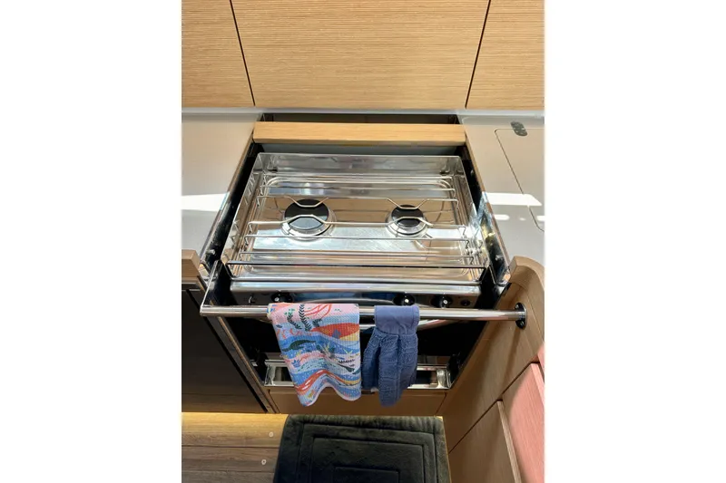 Slide: The Image of Stainless steel stove in 2018 Elan 45 Impressions yacht kitchen with colorful towels. - 48