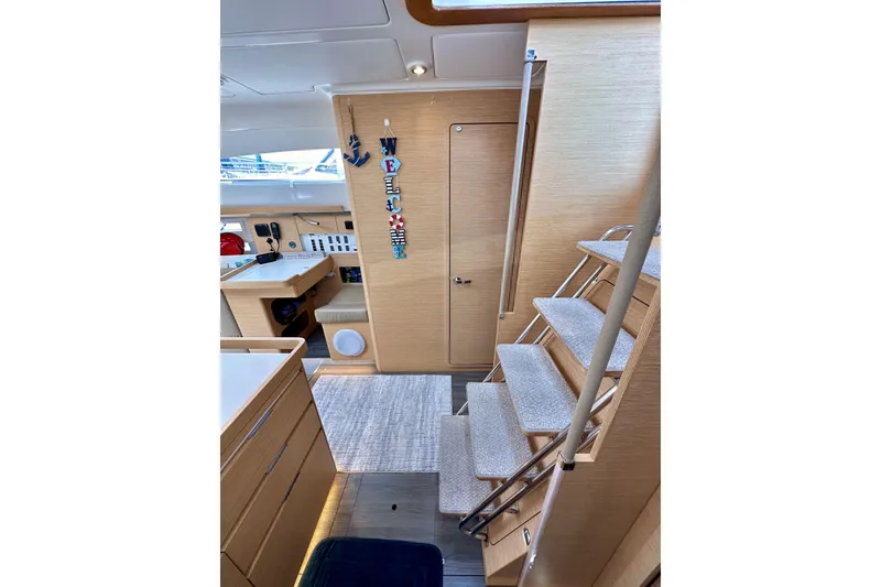 Slide: The Image of Interior of 2018 Elan 45 Impressions yacht with modern wooden design and staircase. - 51