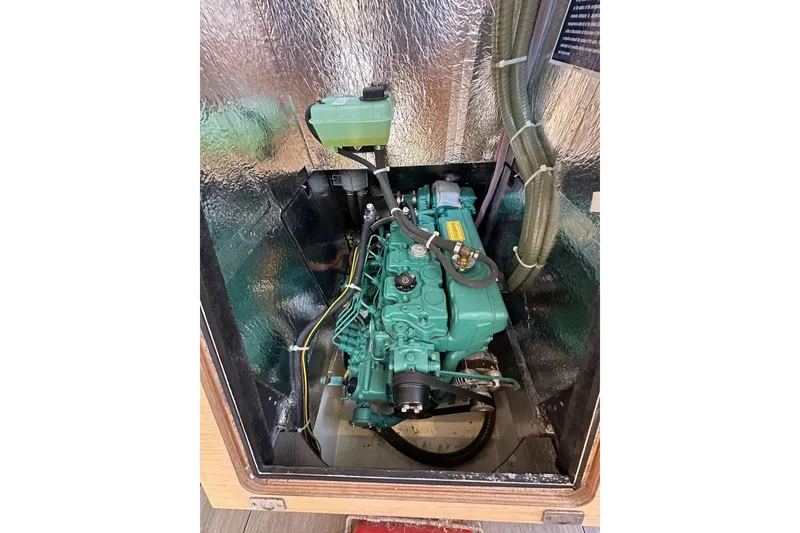 Slide: The Image of Engine compartment of a 2018 Elan 45 Impressions yacht, showcasing the engine and components. - 54