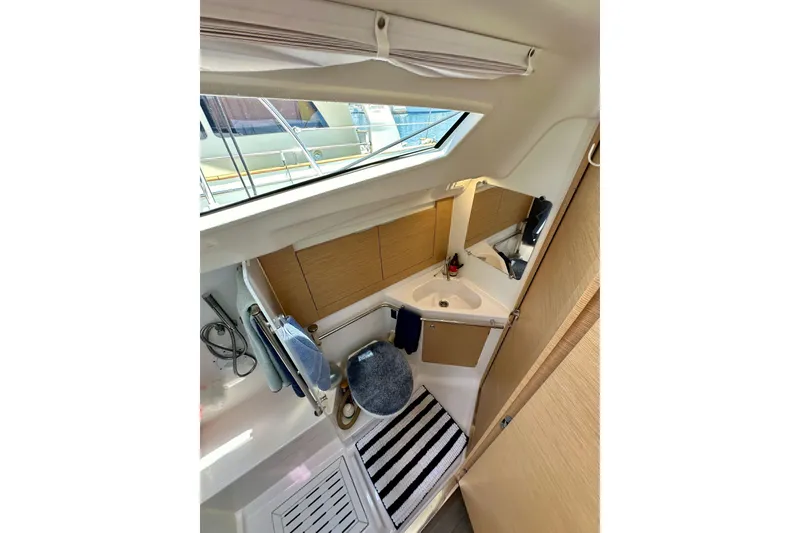 Slide: The Image of Interior of 2018 Elan 45 Impressions yacht bathroom with modern fixtures and striped rug. - 55