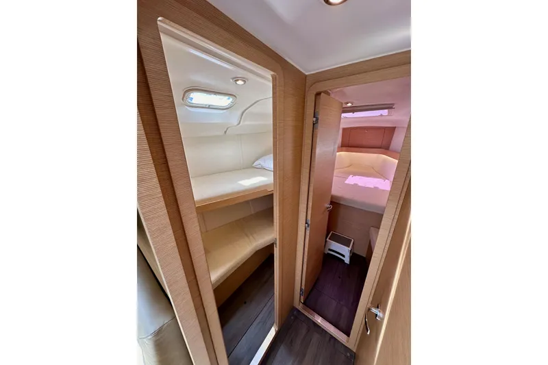 Slide: The Image of Interior of 2018 Elan 45 Impressions yacht, featuring cozy wooden cabin with bunk beds. - 68