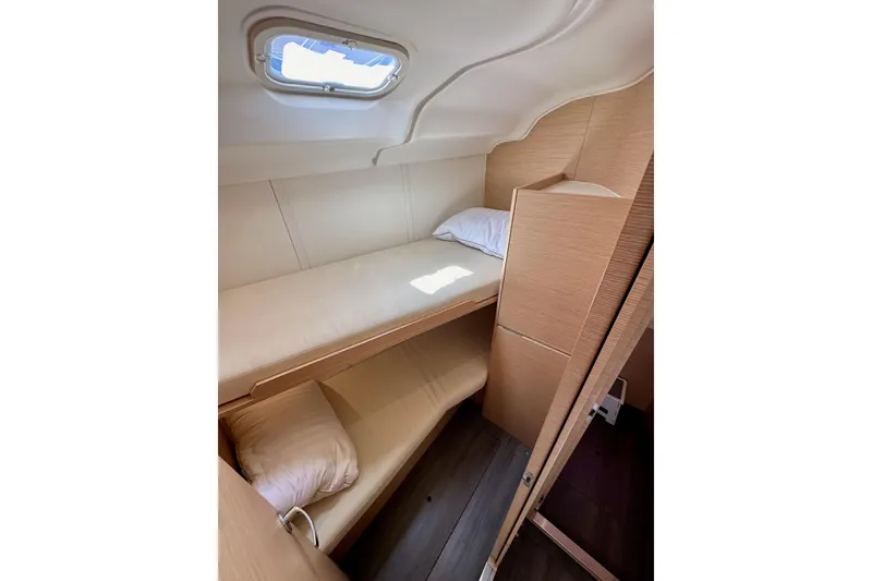 Slide: The Image of 2018 Elan 45 Impressions yacht cabin with bunk beds and natural wood finish. - 69