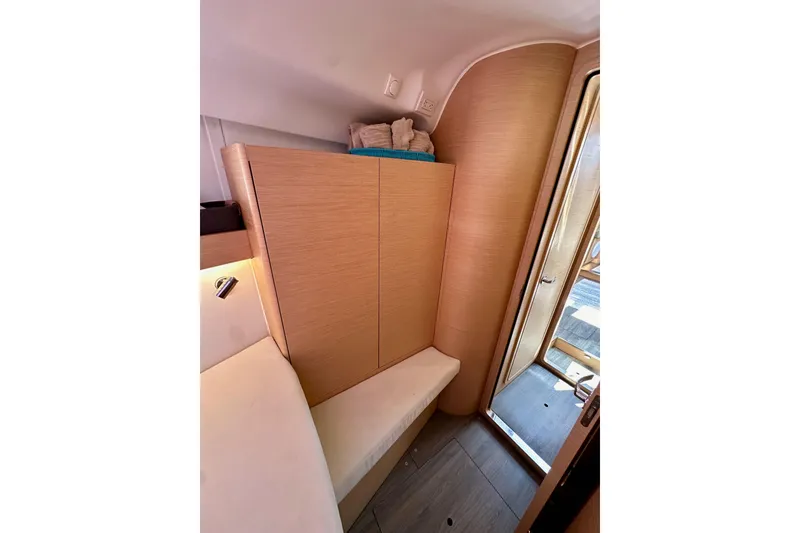 Slide: The Image of Interior of 2018 Elan 45 Impressions yacht, featuring wooden cabinetry and seating. - 73
